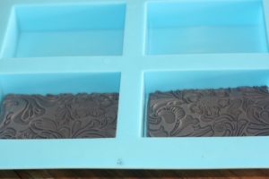 Texture mats in melt and pour soap molds for embossed soap
