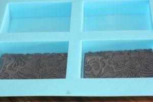 Texture mats in melt and pour soap molds for embossed soap