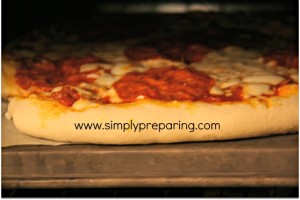 Homemade pizza baking in the oven.